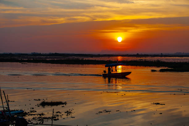 istock Fishing boats in the shadows sunset background. 1131050509