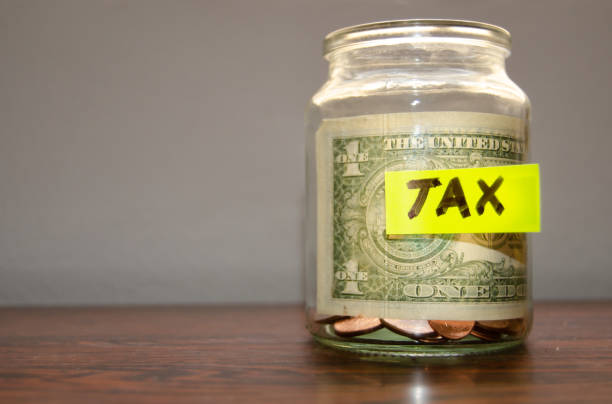 istock jar with coins and dollar inside with mark tax on it 1131050570