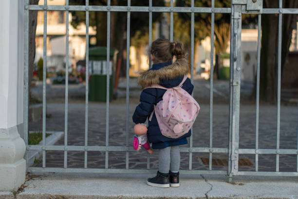 istock Little girl and an iron gate 1131050693