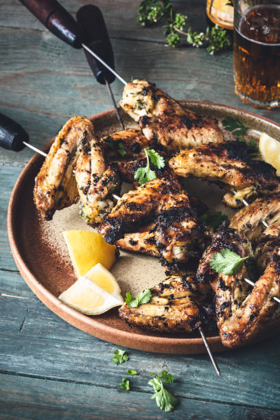 Grilled Chimichurri chicken wing Barbecue for summer Chicken Wing Chimichurri Sauce Grilled Bbq for Summer grillade stock pictures, royalty-free photos & images