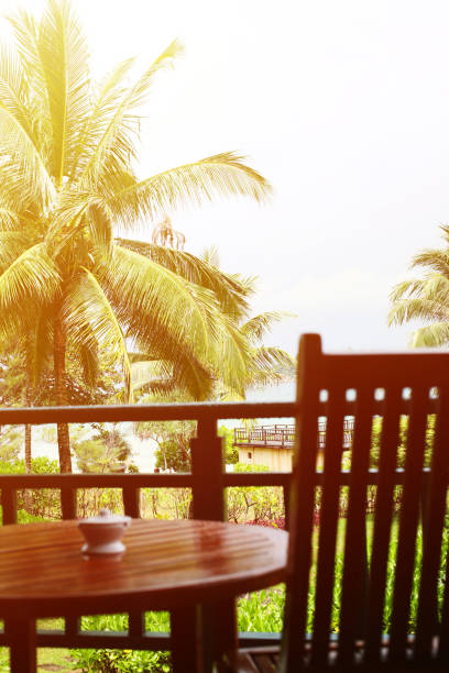 istock Tropical Resort Balcony with Lawn Chair and Table 1131053197