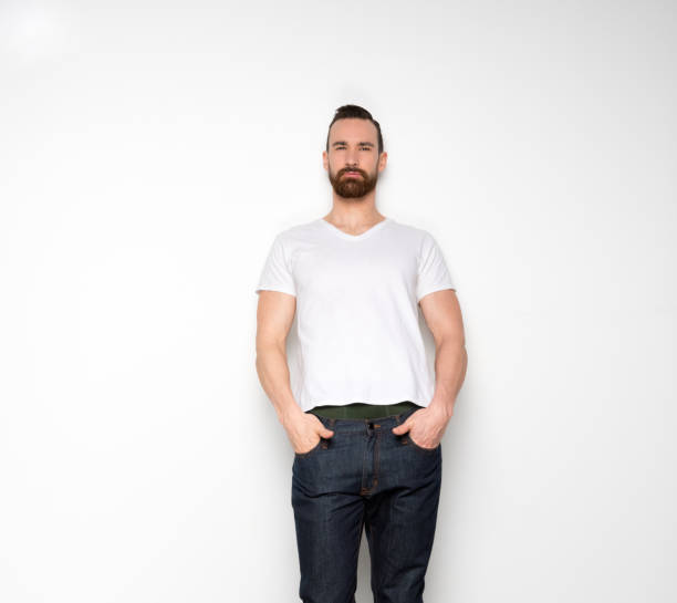 istock Handsome man standing with white shirt on white background 1131055406