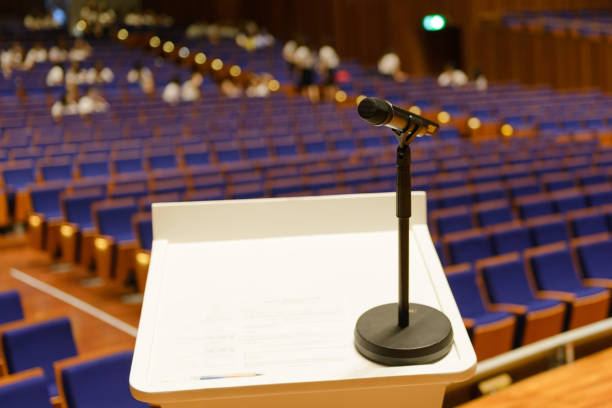 istock Microphone on the podium in seminar or conference hall 1131055575