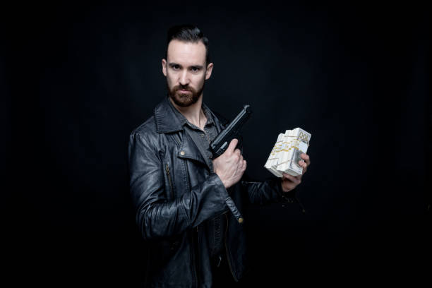 istock Man holding drugs and cash 1131060358