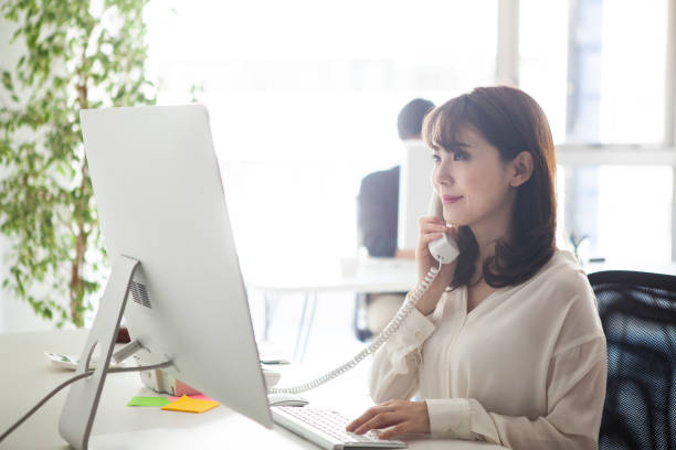 istock Female manager talking with customers on the phone 1131060764