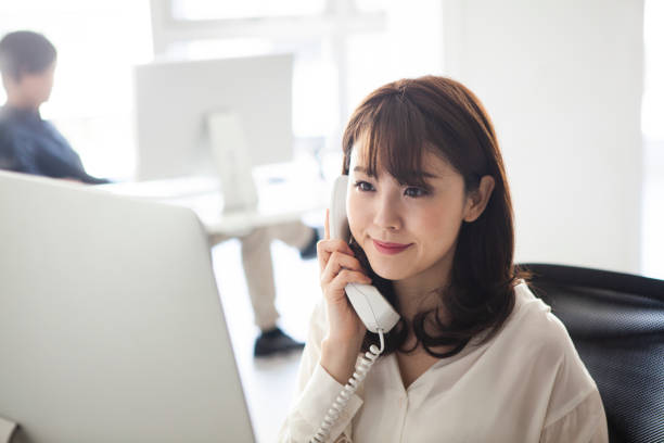 istock Female manager talking with customers on the phone 1131060771