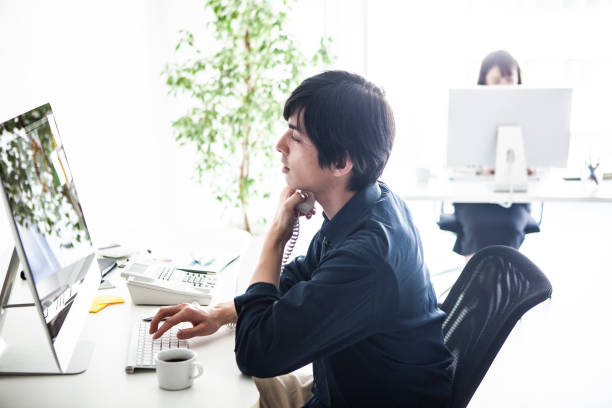 istock Male manager talking with customers on the phone 1131061301