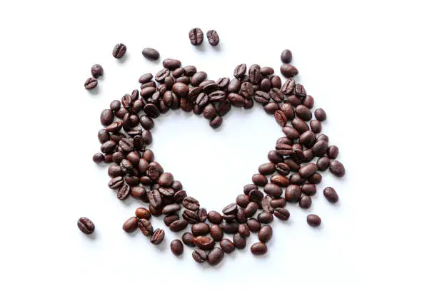 Photo of Love of Coffee Beans in the Shape of a Heart Isolated on White