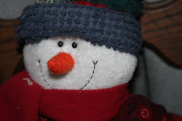 istock Smiling stuffed toy snowman 1131065610