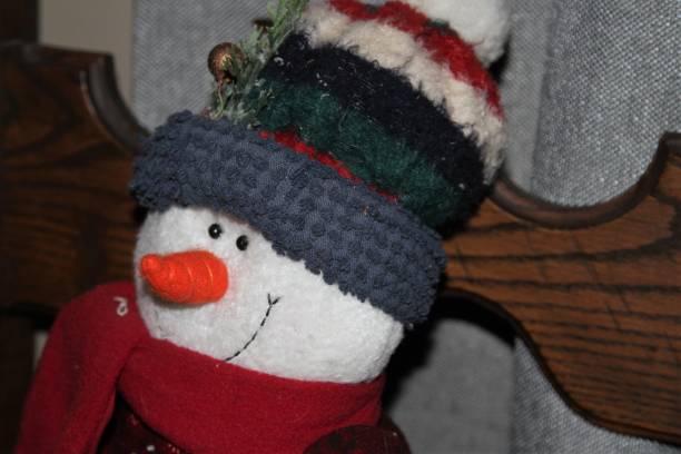 istock Smiling stuffed toy snowman 1131065612