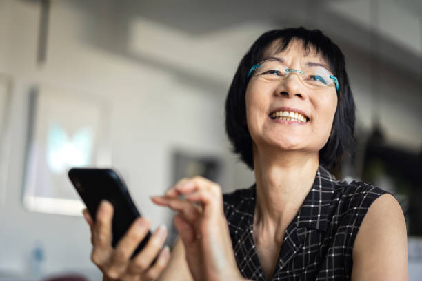 istock Senior Asian woman using a smartphone 1131072028