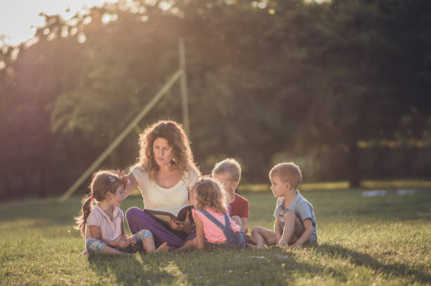 istock Group of happy children having fun in nature 1131074507