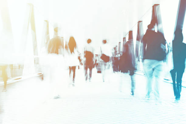 istock Motion Blur of Commuters Walking on Pedestrian Walkway 1131080579