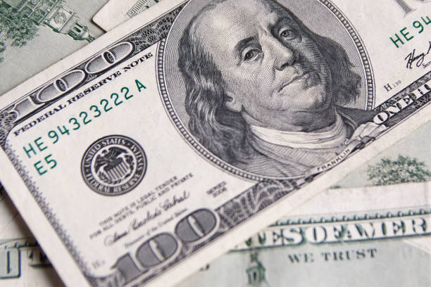 istock Background with money american hundred dollar bills - horizontal 1131083595