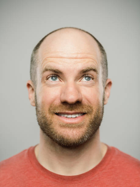 istock Real caucasian man with happy expression looking up 1131085211
