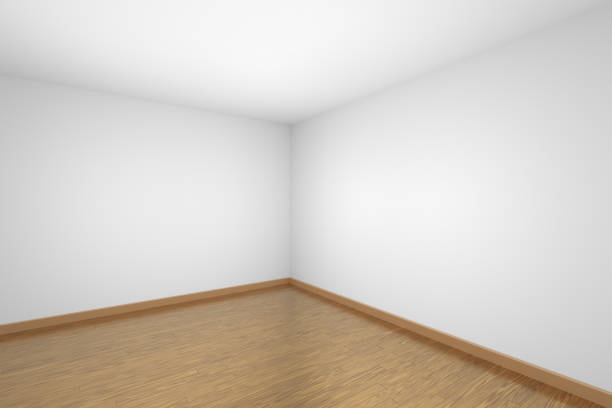 istock Empty white room corner with brown wooden parquet floor 1131085513