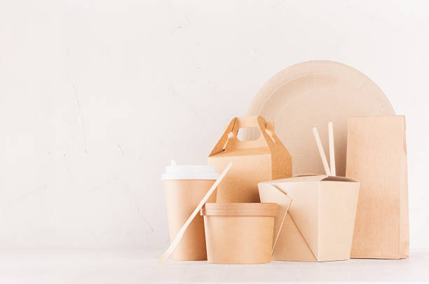 istock Food branding identity mockup in light modern style - blank cardboard container, bowl, box for fast food, drink cup, plate, chopsticks on white wood board. 1131086668