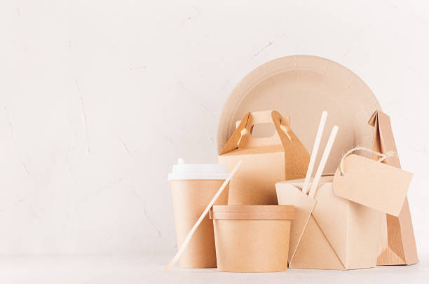 istock Blank different cardboard packaging for fast food - blank label, bowl, cup, box for noodles, cutlery, chopsticks, plate on white wood shelf, copy space. 1131086672
