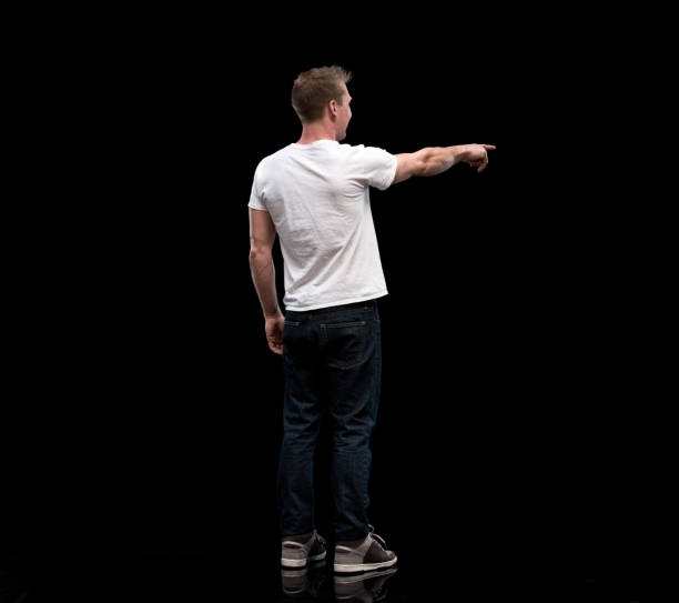 istock Handsome man showing / pointing to the side 1131088620