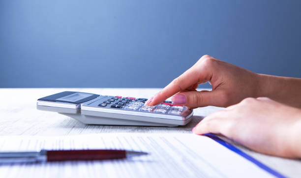 istock businesswoman calculator documents 1131088685