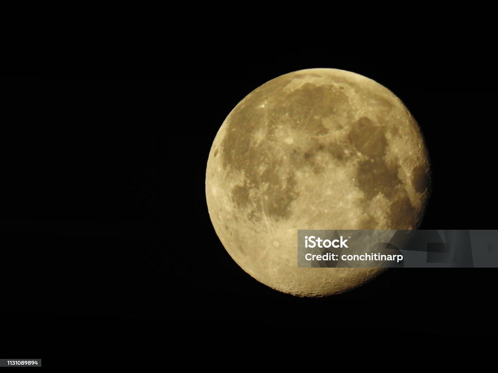 Full Moon on Black sky Large full moon in detail with the geographical features, craters and edges visible. Above Stock Photo