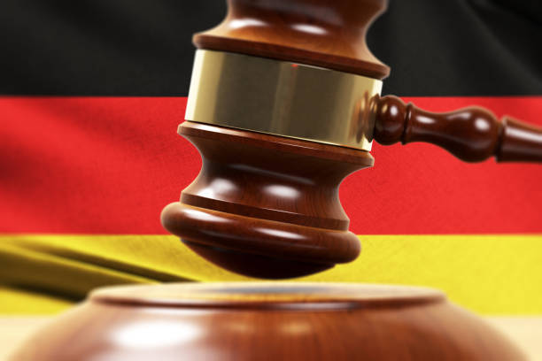 istock Wood Gavel Standing Front Of the German Flag Closeup 3d Render 1131092696