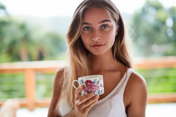 istock Beautiful girl with morning tea 1131092888