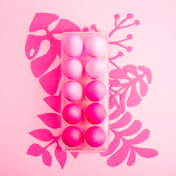 istock Easter 2019 with eggs painted in pink color on a monochrome background 1131093050