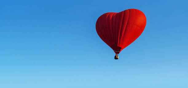 istock Red heart balloon isolated on white background 1131093579
