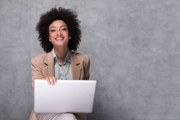 istock Girl using laptop and smiling 1131094468