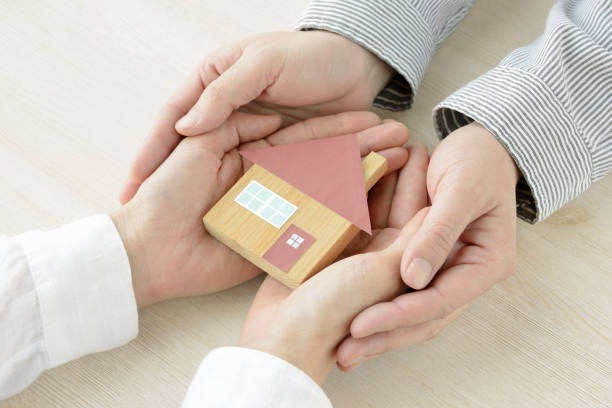 istock House object covered by man and woman's hands 1131094515