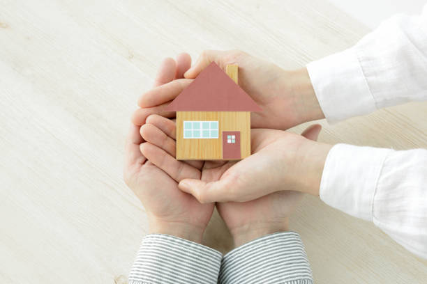istock House object covered by man and woman's hands 1131094534