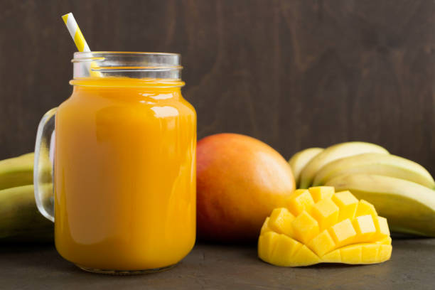istock Fresh fruit juice in the jar. on dark background. 1131095000