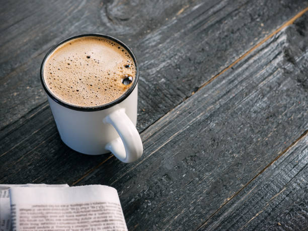 istock Mug of freshly brewed coffee on a dark wooden table 1131095890