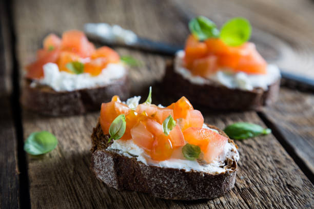 istock Light sandwich with cream cheese, tomatoes and basil 1131096082