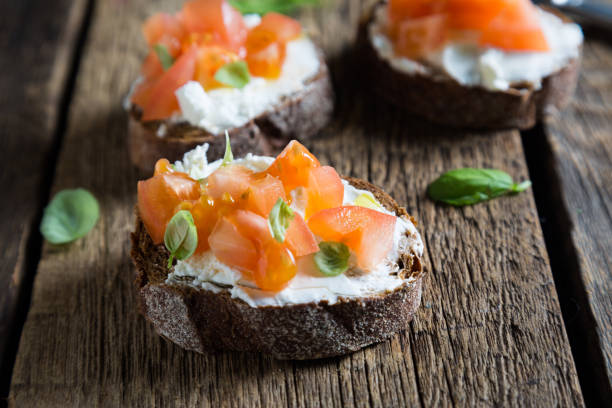 istock Light sandwich with cream cheese, tomatoes and basil 1131096166