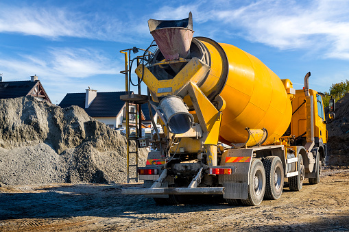 Concrete mixer truck on the construction of a local road in the suburbs, Szczecin, Poland