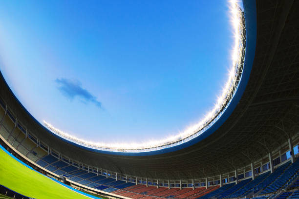istock Spotlights and floodlights at a stadium at night 1131097403