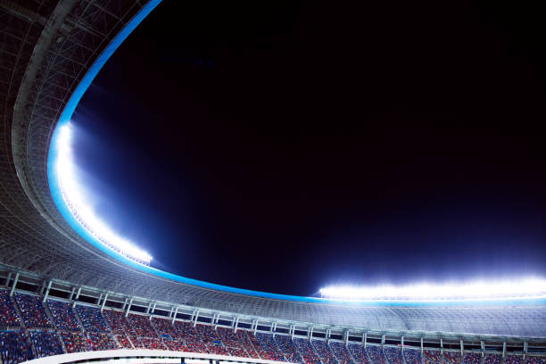 istock Spotlights and floodlights at a stadium at night 1131098314