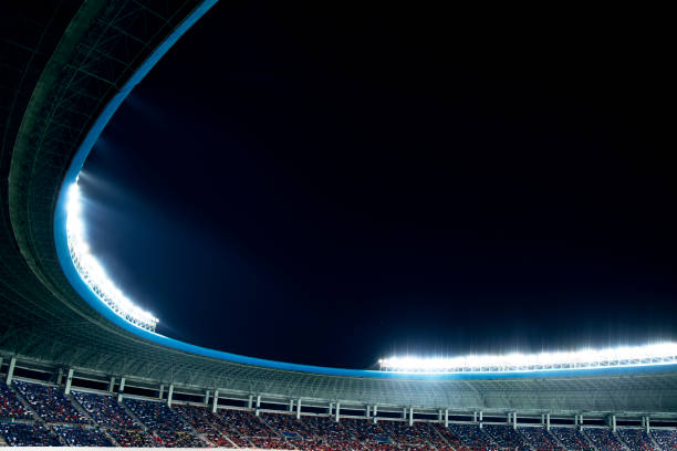 istock Spotlights and floodlights at a stadium at night 1131098333