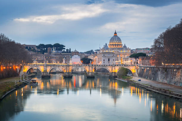 istock Saint Peter Basilica in Vatican city with Saint Angelo Bridge in Rome 1131098881