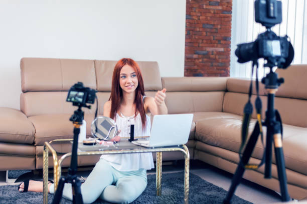 istock Young female vlogger recording a make-up video for her vlog. 1131100164