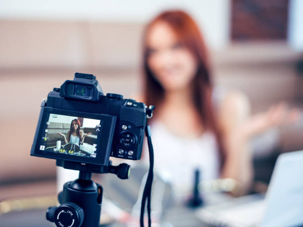 istock Young female vlogger recording a make-up video for her vlog. 1131100981
