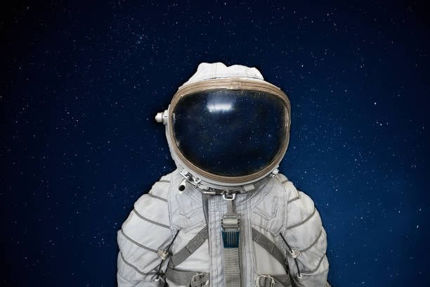istock Soviet cosmonaut or astronaut or spaceman suit and helmet on black space with stars background 1131101043