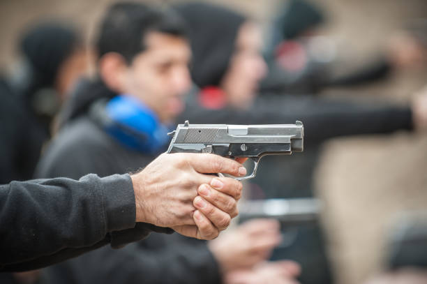 istock Close-up view of shooter practice handgun shooting in row group 1131101604