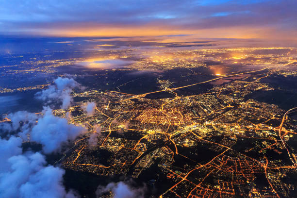 Leiden from the sky at night night Beautiful aerial cityscape view of the city of Leiden, the Netherlands, after sunset at night in the blue hour center of the universe stock pictures, royalty-free photos & images