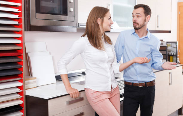 istock Couple talking in  kitchen furnishing store 1131105364