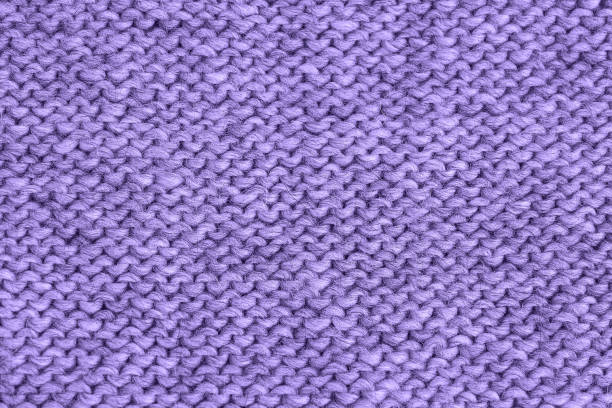 istock Violet knitted texture. Handmade Knitwear. Yarn Background 1131105426