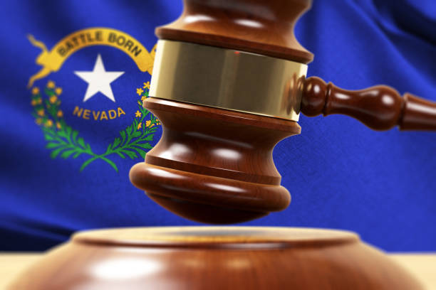 istock Wood Gavel Standing Front Of the Nevada State Flag Closeup 3d Render 1131105731