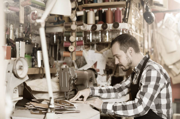 istock Professional man worker working on stitches for belt 1131105875